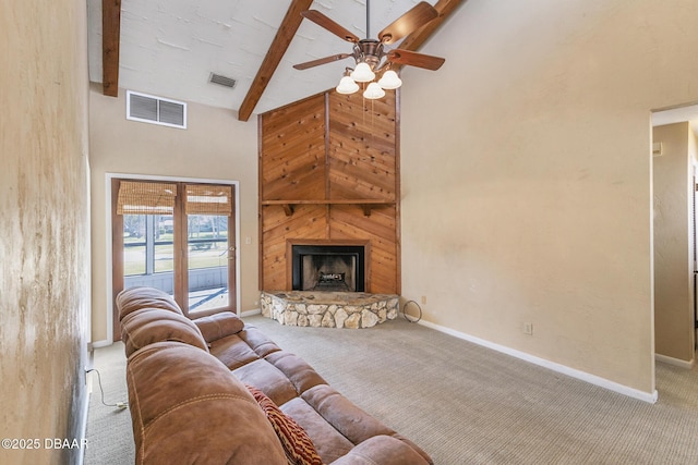 living room featuring high vaulted ceiling, a fireplace, carpet floors, and beam ceiling