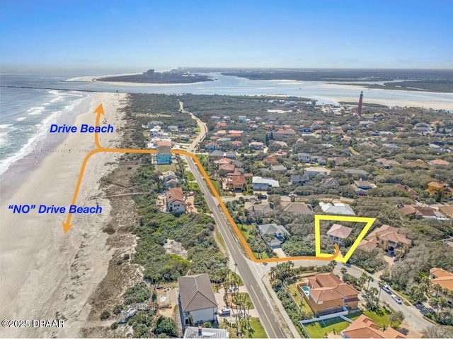 birds eye view of property featuring a water view and a residential view