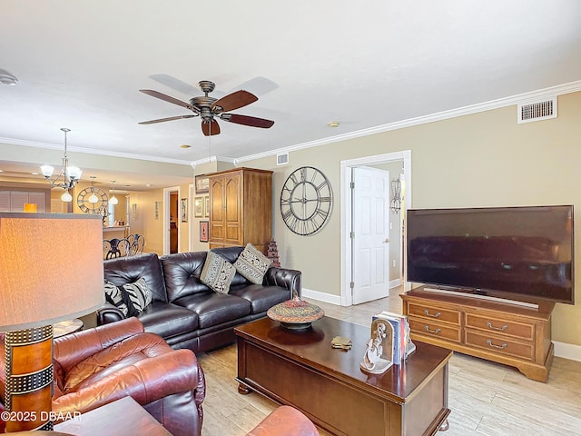 living room with ceiling fan with notable chandelier, light wood-type flooring, and crown molding