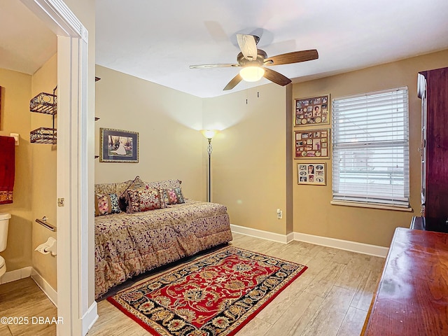 bedroom with ceiling fan and light hardwood / wood-style floors