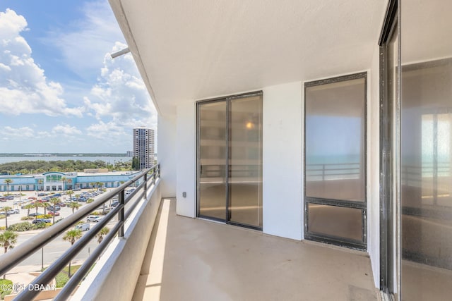 balcony featuring a water view