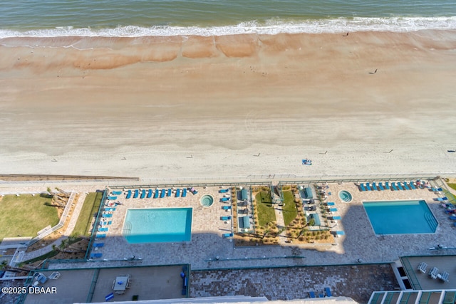 aerial view featuring a water view and a beach view