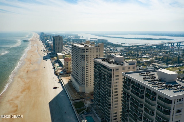 property's view of city with a water view and a beach view