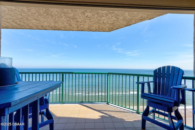 balcony featuring a water view