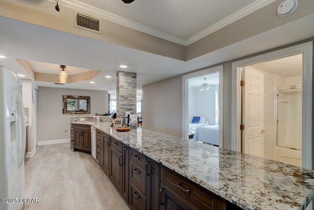 3311 S Atlantic Ave Unit 1504, Daytona Beach Shores, FL 32118 - kitchen featuring ceiling fan, light wood finished floors, white appliances, baseboards, and visible vents