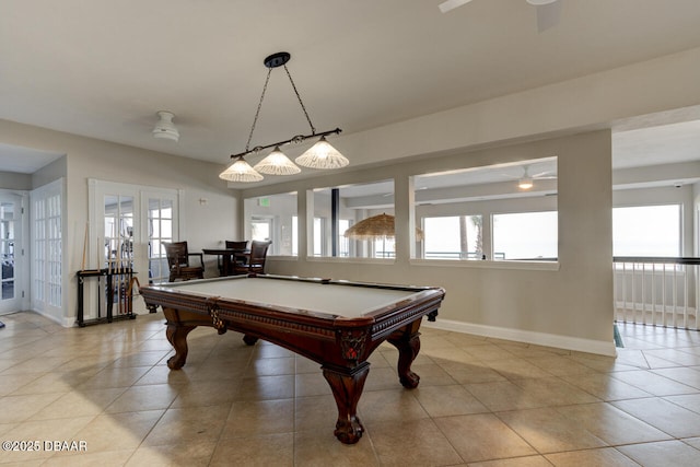 recreation room featuring a healthy amount of sunlight and ceiling fan