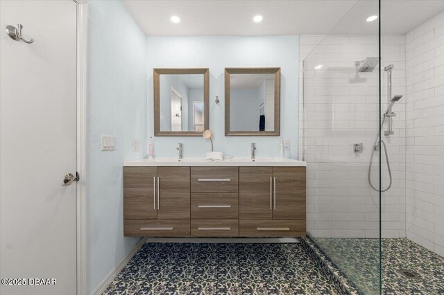 217 Royal Dunes Cir, Ormond Beach, FL 32176 - full bath with tiled shower, double vanity, recessed lighting, baseboards, and tile patterned floors