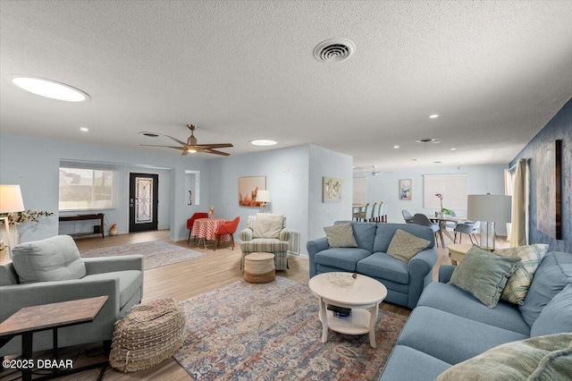 217 Royal Dunes Cir, Ormond Beach, FL 32176 - living area featuring ceiling fan, wood finished floors, recessed lighting, and a textured ceiling