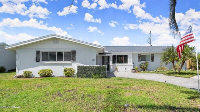 217 Royal Dunes Cir, Ormond Beach, FL 32176 - single story home with a front yard and asphalt driveway
