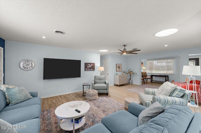 217 Royal Dunes Cir, Ormond Beach, FL 32176 - living room with light wood-style flooring, a textured ceiling, recessed lighting, baseboards, and ceiling fan