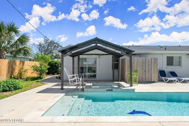 217 Royal Dunes Cir, Ormond Beach, FL 32176 - rear view of property with a patio and an in-ground hot tub