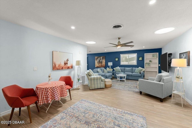 217 Royal Dunes Cir, Ormond Beach, FL 32176 - living room featuring baseboards, light wood finished floors, ceiling fan, and recessed lighting