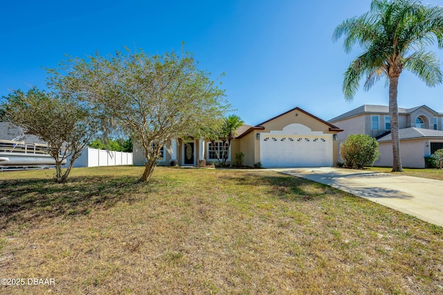view of front of home featuring a front lawn, a garage, driveway, stucco siding, and fence