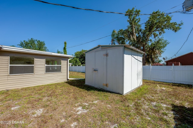 view of shed with fence