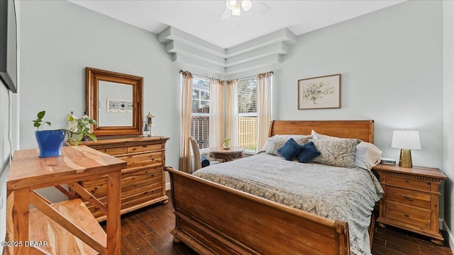 bedroom with dark wood-style floors and ceiling fan