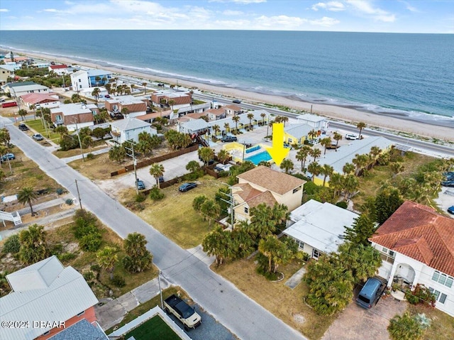 bird's eye view featuring a water view and a view of the beach