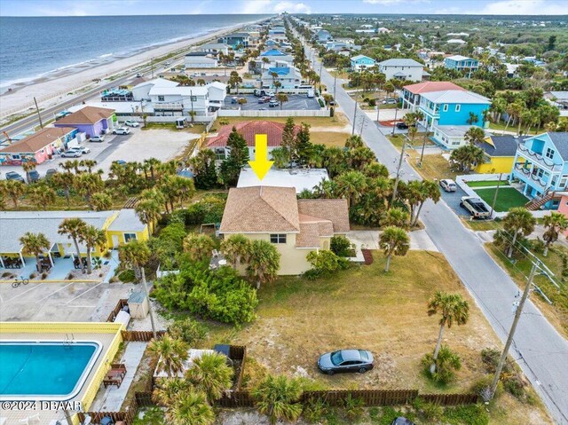 aerial view with a water view and a view of the beach