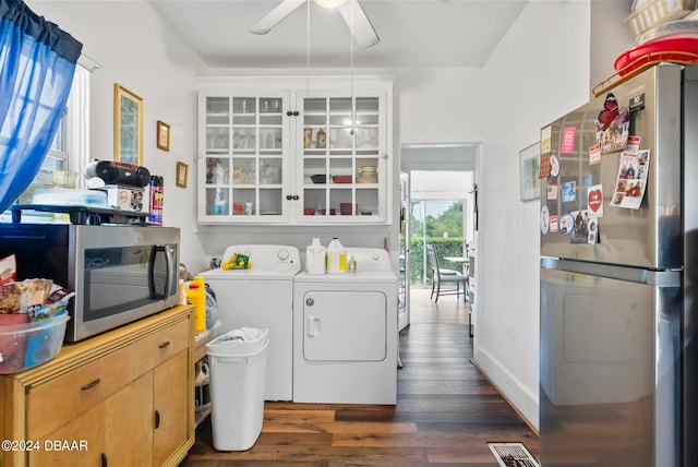 laundry area featuring washing machine and dryer, ceiling fan, and dark hardwood / wood-style flooring