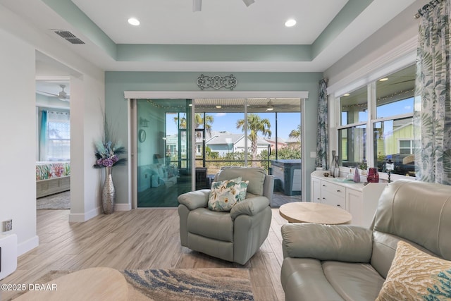 418 Good Life Way, Daytona Beach, FL 32124 - interior space featuring ceiling fan, light wood-type flooring, and a tray ceiling