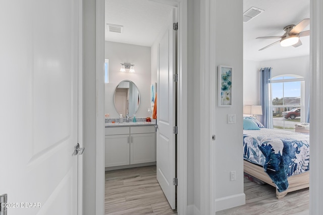 418 Good Life Way, Daytona Beach, FL 32124 - bathroom featuring wood-type flooring, vanity, and ceiling fan