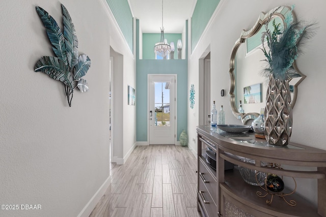 418 Good Life Way, Daytona Beach, FL 32124 - entrance foyer with a chandelier and light hardwood / wood-style flooring