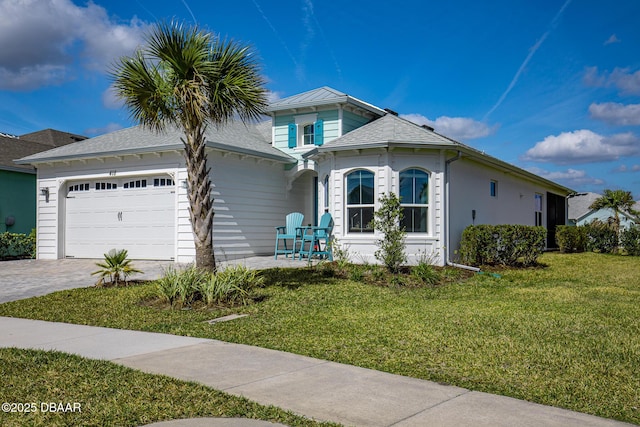 418 Good Life Way, Daytona Beach, FL 32124 - view of front of house featuring a garage and a front yard