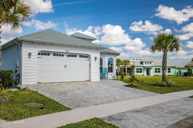 418 Good Life Way, Daytona Beach, FL 32124 - view of front of house featuring a garage and a front lawn