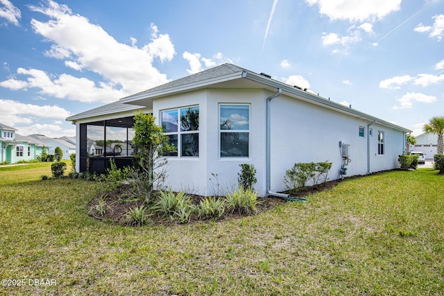 418 Good Life Way, Daytona Beach, FL 32124 - view of property exterior featuring a sunroom and a lawn