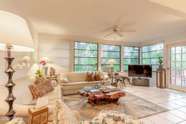 tiled living room with ceiling fan