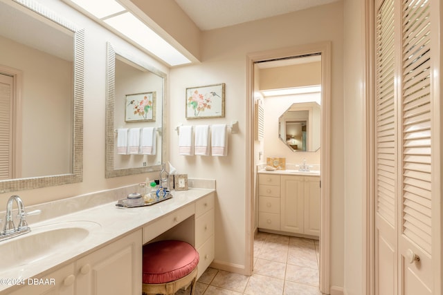 bathroom featuring vanity and tile patterned flooring