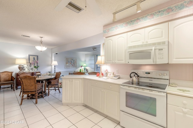 kitchen featuring decorative light fixtures, a textured ceiling, white appliances, and ceiling fan