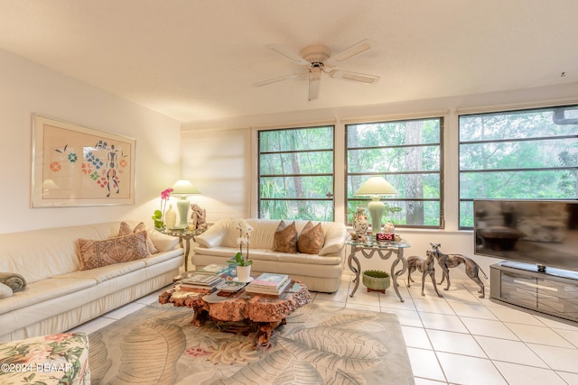 tiled living room featuring plenty of natural light and ceiling fan