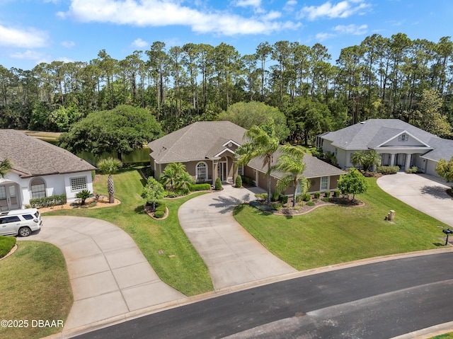 850 Westlake Dr, Ormond Beach, FL 32174 - view of front of property featuring curved driveway and a front yard