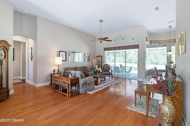 850 Westlake Dr, Ormond Beach, FL 32174 - living area with visible vents, light wood finished floors, ceiling fan, and a towering ceiling