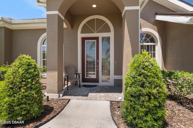 850 Westlake Dr, Ormond Beach, FL 32174 - doorway to property featuring stucco siding