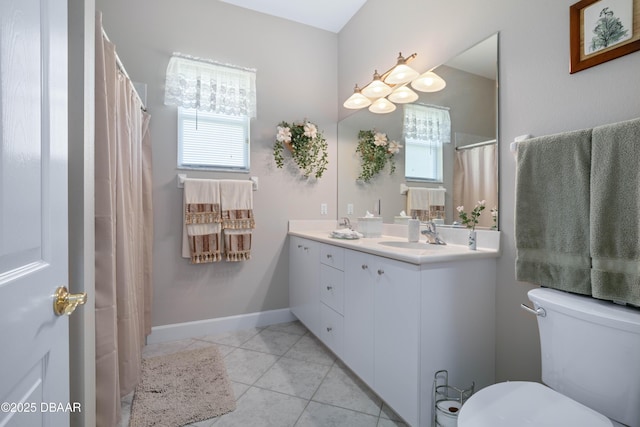 850 Westlake Dr, Ormond Beach, FL 32174 - bathroom featuring double vanity, toilet, a healthy amount of sunlight, and a sink