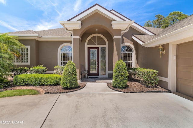850 Westlake Dr, Ormond Beach, FL 32174 - doorway to property with a shingled roof and stucco siding