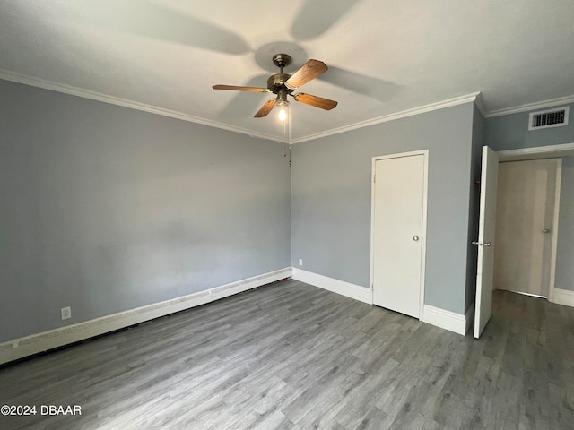 unfurnished bedroom featuring wood-type flooring, ceiling fan, and crown molding