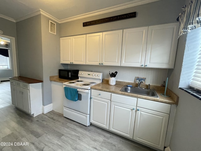 500 S Beach St Unit F-1, Daytona Beach, FL 32114 - kitchen with electric range, a sink, black microwave, crown molding, and light wood finished floors