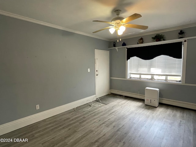 empty room featuring light hardwood / wood-style floors, ceiling fan, and crown molding