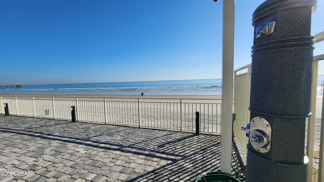 219 S Atlantic Ave Unit 135, Daytona Beach, FL 32118 - view of patio / terrace with view of water and beach