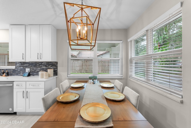 dining space featuring a chandelier and light hardwood / wood-style floors