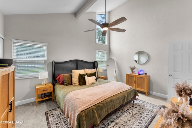 carpeted bedroom featuring beamed ceiling, ceiling fan, and high vaulted ceiling