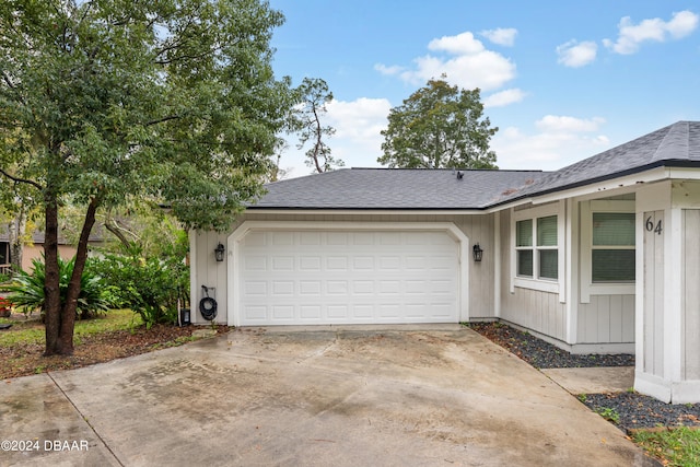 view of side of home with a garage