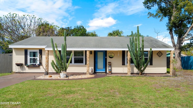 ranch-style home with a front yard