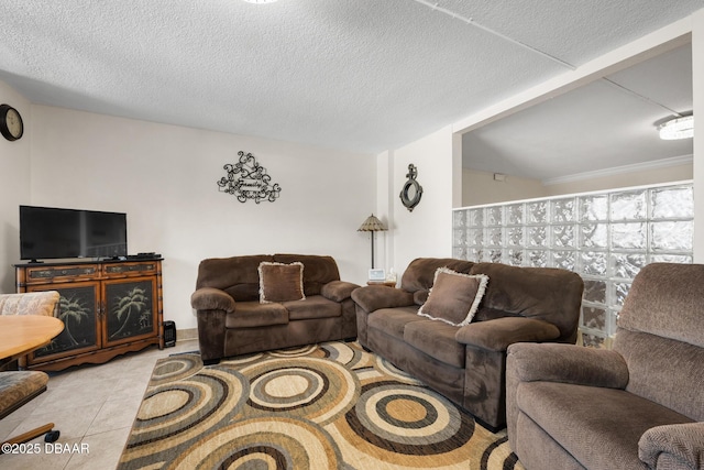 living room featuring light tile patterned flooring and a textured ceiling