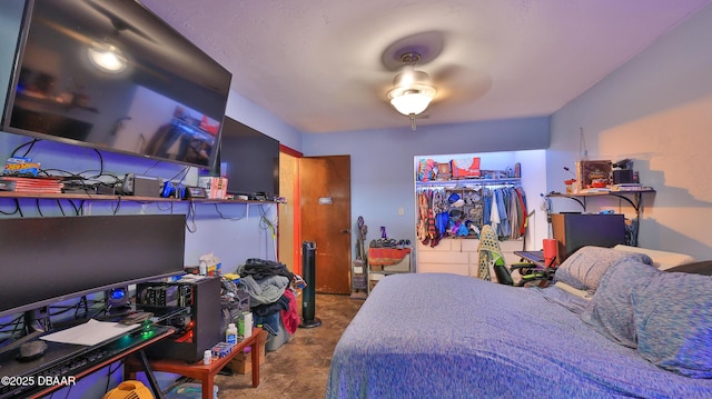 carpeted bedroom with a closet and a ceiling fan