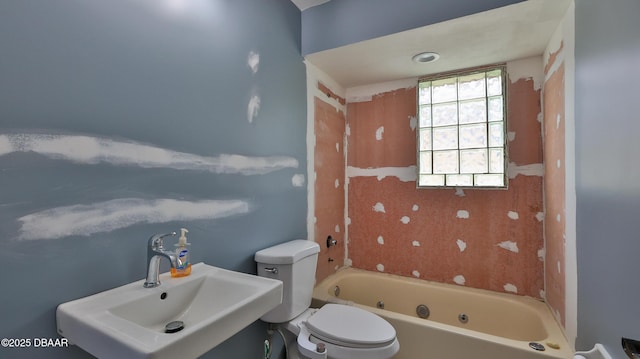 full bath featuring a sink, toilet, and bathtub / shower combination