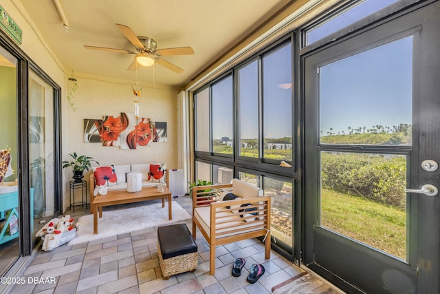 456 Bouchelle Dr Unit 104, New Smyrna Beach, FL 32169 - sunroom with a wealth of natural light and a ceiling fan