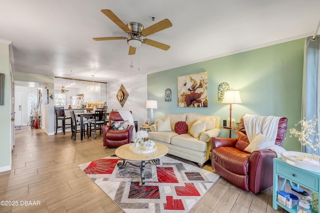 456 Bouchelle Dr Unit 104, New Smyrna Beach, FL 32169 - living room featuring a ceiling fan, wood finished floors, and ornamental molding